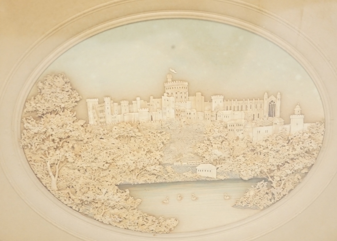 A framed and mounted oval cork picture of Windsor Castle, 8cm wide. Condition - some foxing to mount and background, frame needs attention